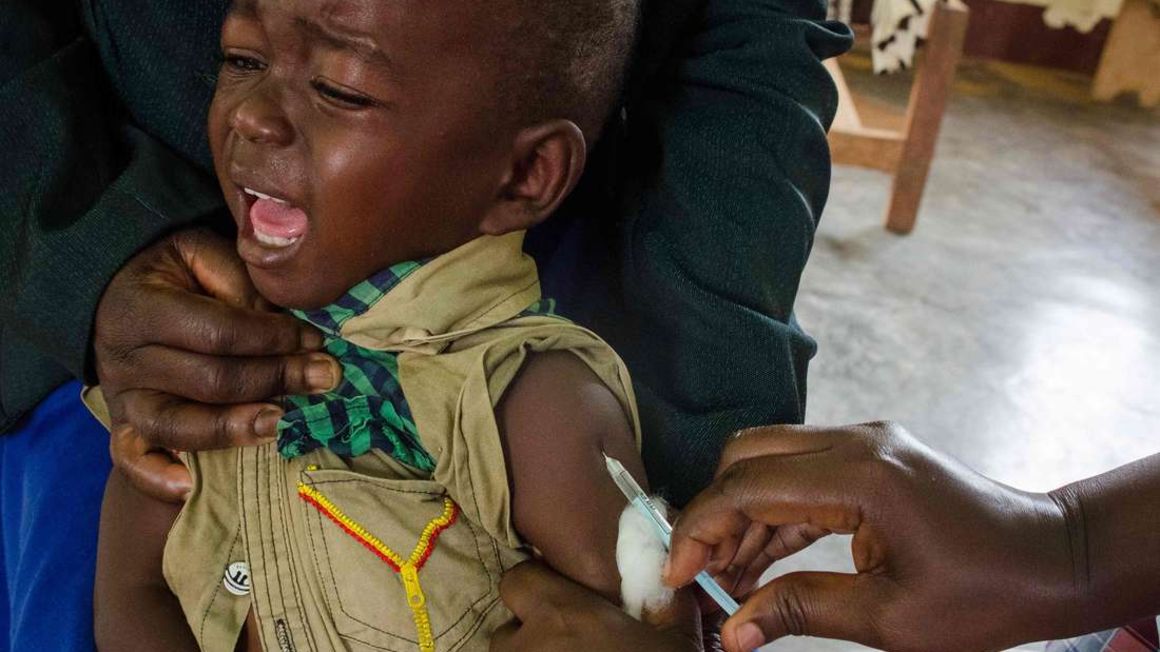 A child receives an injection during a vaccination campaign against measles, rubella and polio in Uganda on October 19, 2019. PHOTO | BADRU KATUMBA | AFP