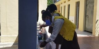 Students wash hands.