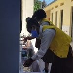 Students wash hands.