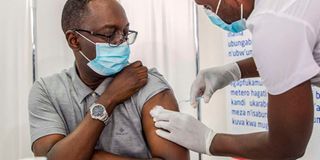 Rwanda's Health Minister Daniel Ngamije receives Covid-19 vaccine.