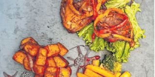 The roasted potatoes with chicken served with vegetables at The Secret.