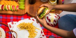 A customer displays his Ballistic Burger.