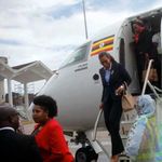 Passengers disembarking from a Uganda Airlines flight 