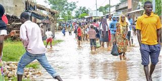 People walk through Buterere, northwest of Bujumbura