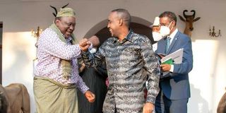 President Uhuru Kenyatta accepts Somali traditional gifts from Prime Minister Mohamed Roble