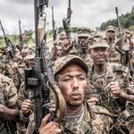 Ethiopian soldiers hold their guns after training.