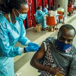 Health workers administer Covid-19 vaccines in Rwanda.