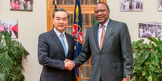 China's Foreign Minister Wang Yi with Kenyan President Uhuru Kenyatta.