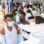 Medical officials administer Covid-19 vaccines in Rwanda.
