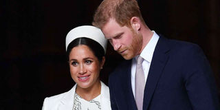 Britain's Prince Harry and his wife Meghan.