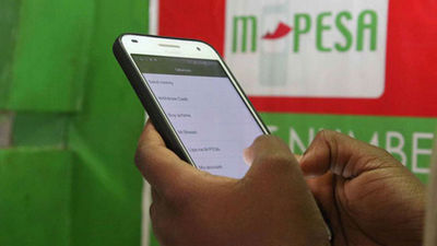 A client using mobile money service M-Pesa. 