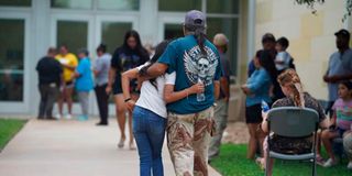 Families gather and hug on May 24, 2022 outside the Willie de Leon Civic Center in Texas.