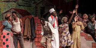 Thespians act out a scene in a historic play, "Ngaahika Ndeenda" ("I Will Marry When I Want").