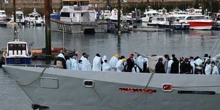 Migrants at Dover after crossing the English Channel.
