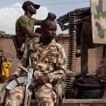 Nigerian soldiers patrol 