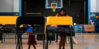 A woman votes in the US midterm elections 