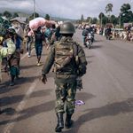 Congolese soldier walks in Kanyaruchinya, north of Goma 