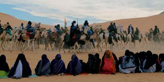 Tuareg camel riders perform