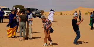 Tourists take photographs 