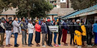 Kenyans queue to vote on August 9, 2022.