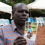 Mr Gilbert Kirwa Maina with a photo of his son,