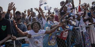Catholic faithful cheer as Pope Francis arrives