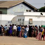 People gather at a bank in Ibafo, Ogun State in Nigeria 
