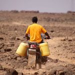 A man ferries water to his home in Kenya’s drought-hit Marsabit