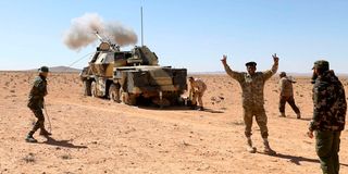 Libya army fire rifles