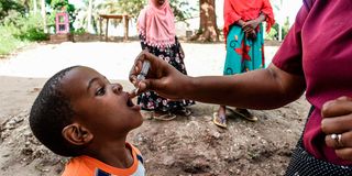 A child receives polio vaccine.