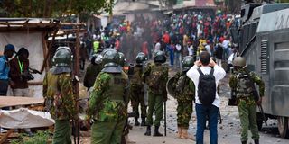 Police officers block protestors in Kibera, Nairobi 