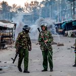 Kenyan police officers patrol a street in Nairobi