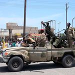 People greet Sudanese army soldiers 