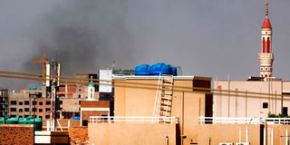 Smoke billows over residential buildings in eastern Khartoum 