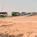 buses transporting people fleeing war in Sudan 