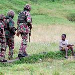 Kenyan soldiers patrol near Kibumba B market in DR Congo