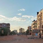 People walk on a street in southern Khartoum 