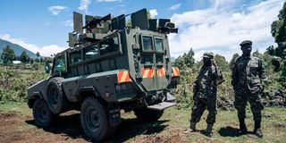 Ugandan soldiers from EACRF stand guard 