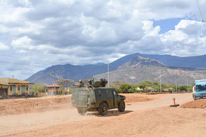 An armoured personnel carrier patrolling Kainuk town